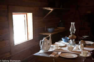The 1864 Cracker Homestead is complete with antique furnishings and vintage farm equipment.