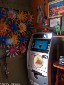 Satchel's doesn't take credit or debit cards, but there's an ATM.  And the ATM fees all go to charity!