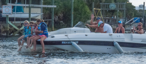 Yes, the kids are wearing life jackets, but "bow riding" is a serious "no-no"!!!