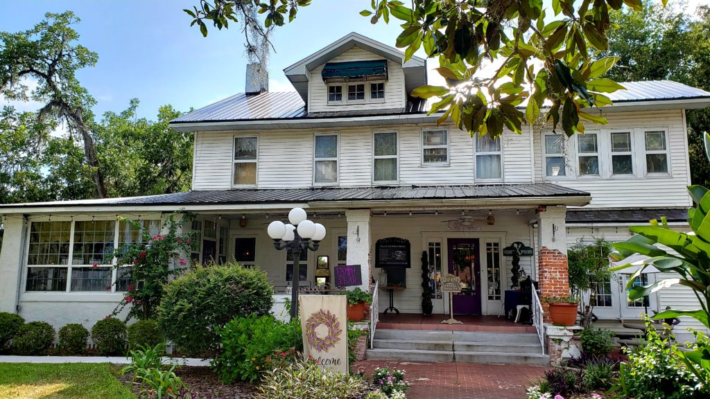 White three story house that is restaurant