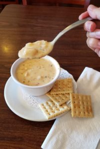 A spoonful of thick, rich clam chowder heading for my mouth!