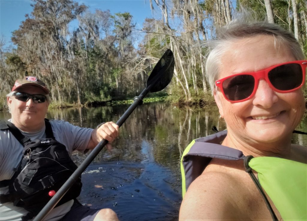 Man and woman paddling a kayak