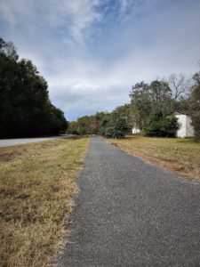 Paved bike trail beside a country road