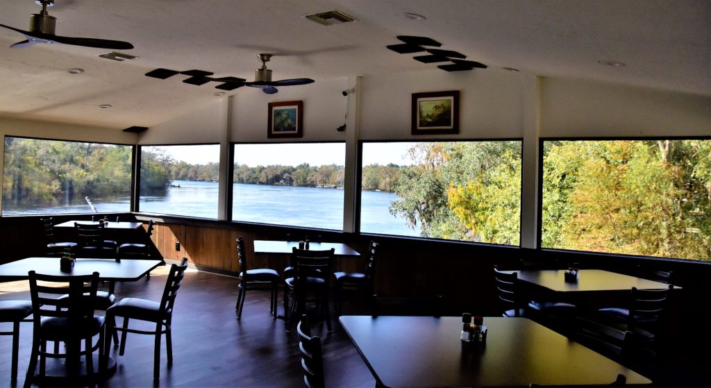 dining room with a view of the river