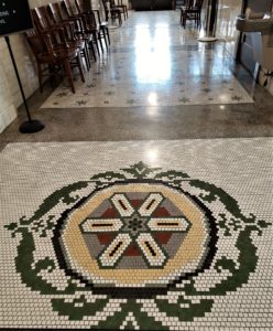 Intricate tile mosaic floor in historic court house entryway