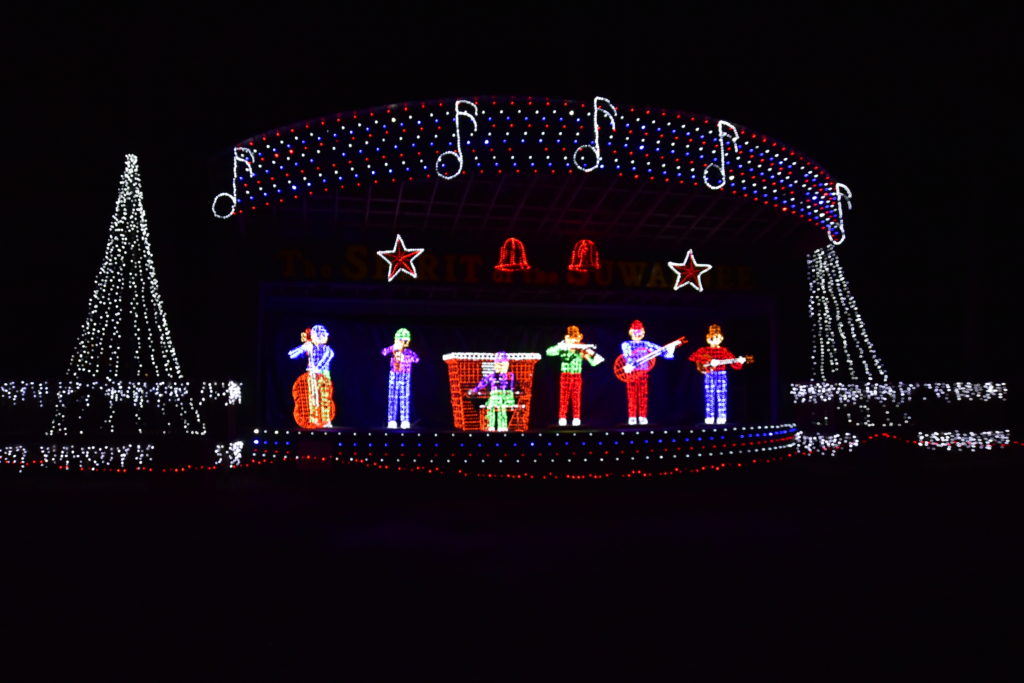animated band playing on stage with Christmas lights
