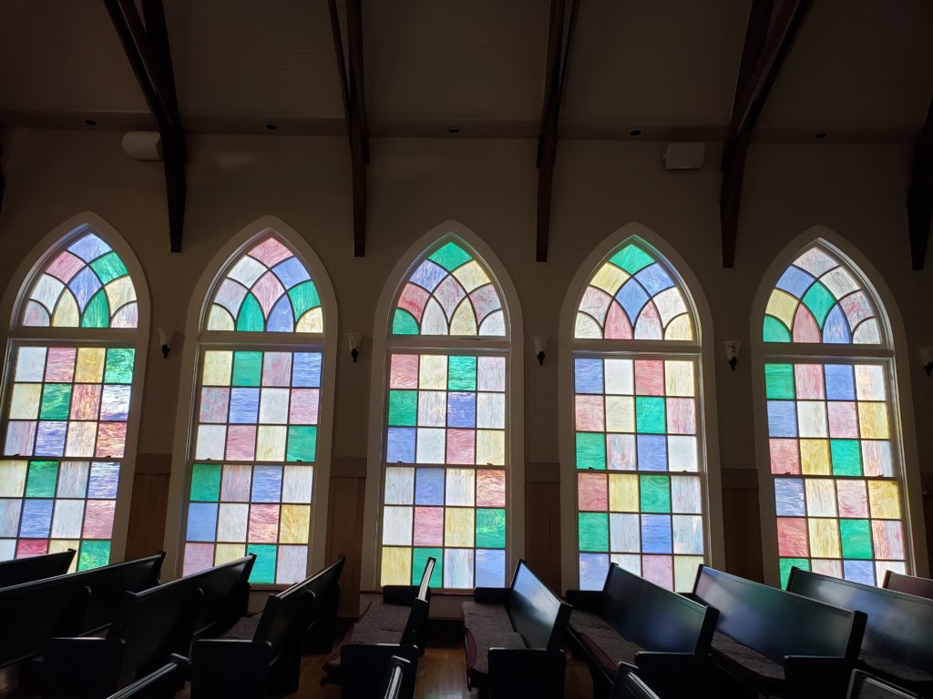 gothic shaped stined glass windows inside the chapel