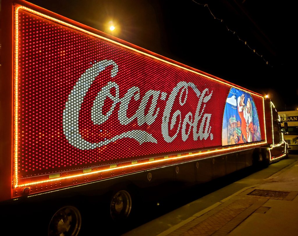 Coca-Cola 18-wheeler, lit up with image of the Coca-Cola Santa