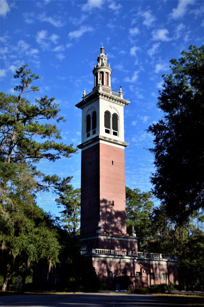 Tall tower with fancy copoula on top, blue sky